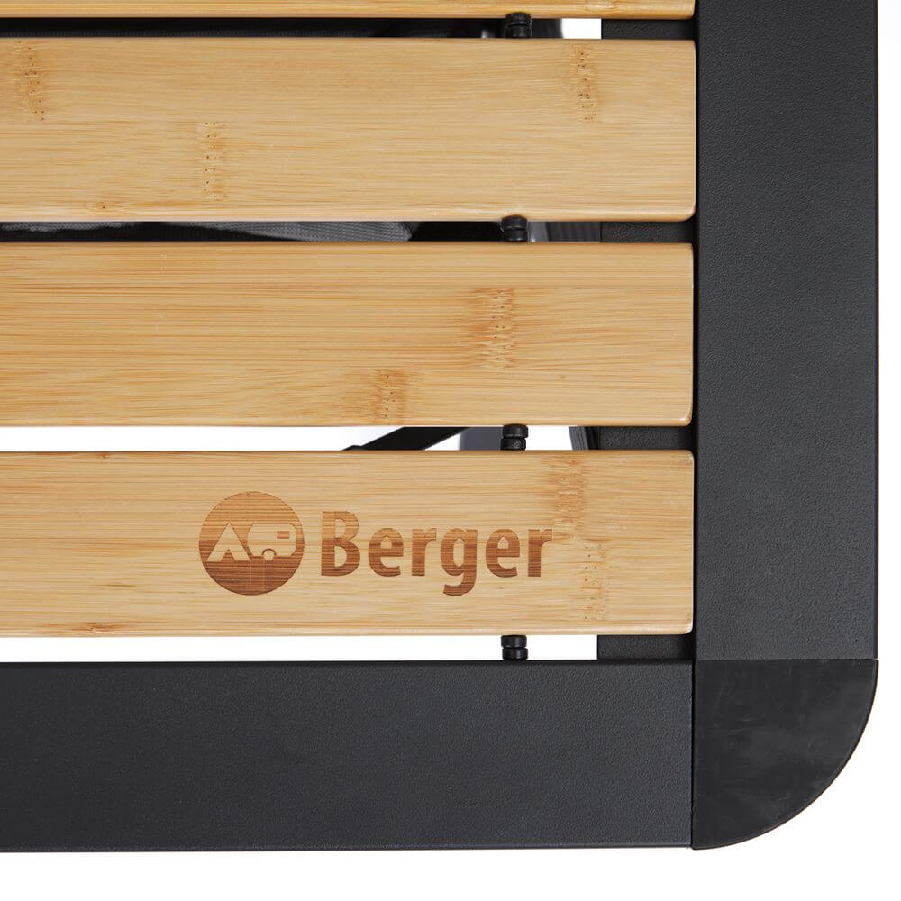 Close-up of Berger black folding camping table with bamboo top.