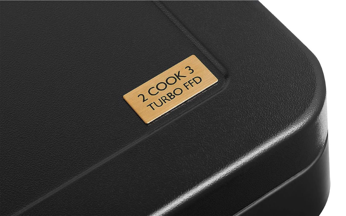 Close-up of CADAC 2 Cook 3 Turbo FFD gas stove label, highlighting dual burner with wind protection and Flame Failure Device.